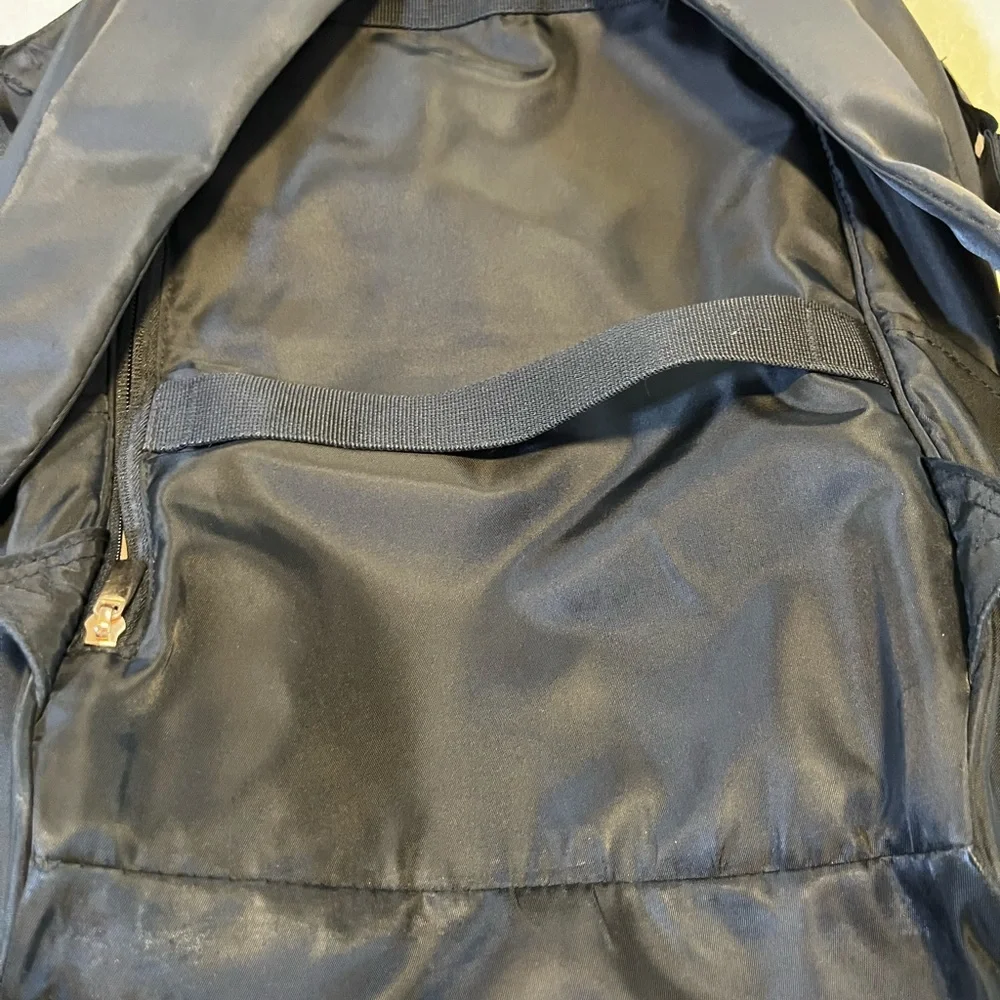 Black Quilted Travel Backpack with Gold Trim